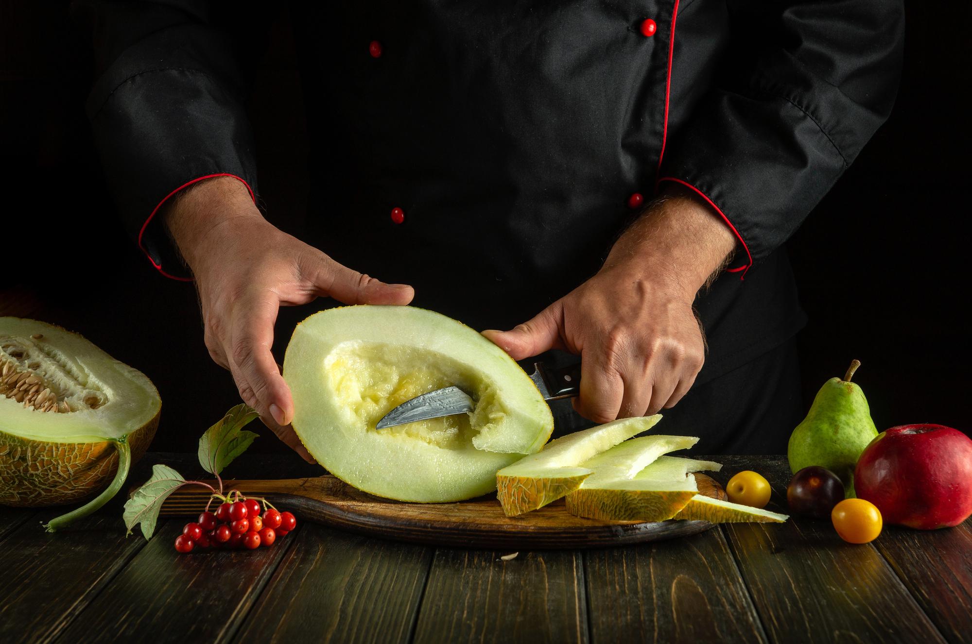 Chef hands slicing vegetables swiftly